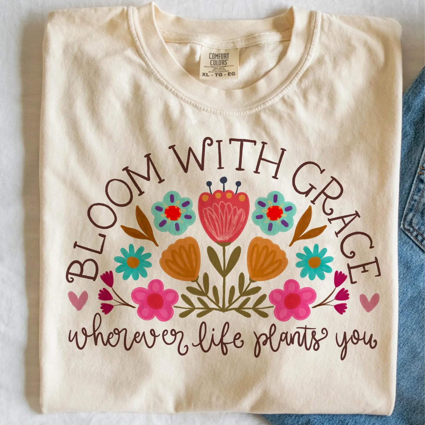 Black Bloom With Grace Wherever Life Plants You Ivory Tee